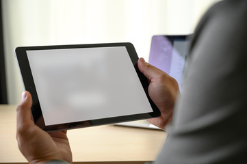 Wall Mural - man  hands multitasking man using tablet close up close up working in office