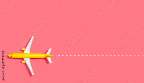 Fotografiet  Toy miniature airplane overhead view flat lay