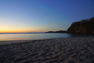 Wall Mural - Dramatic orange sunset sky over the Playa Virador beach in Peninsula Papagayo, Guanacaste, Costa Rica