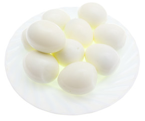 Peeled boiled eggs in a plate on a white background