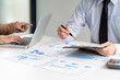 © mojo_cp - Investment and cooperate concept, business financial inspector analyzing about parformance data in office meeting.