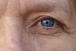 © michaelheim - Extreme Cropped blue Eye of a middle-aged woman
