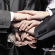 © yurolaitsalbert - close up.a group of business people folded their hands together