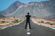 Boy in the middle of the road. Adventure travel in Morocco, incredible landscape in Africa