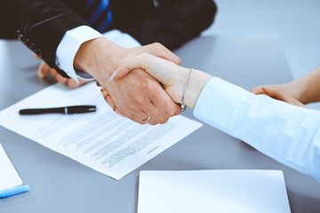 Business people shaking hands, finishing up a meeting