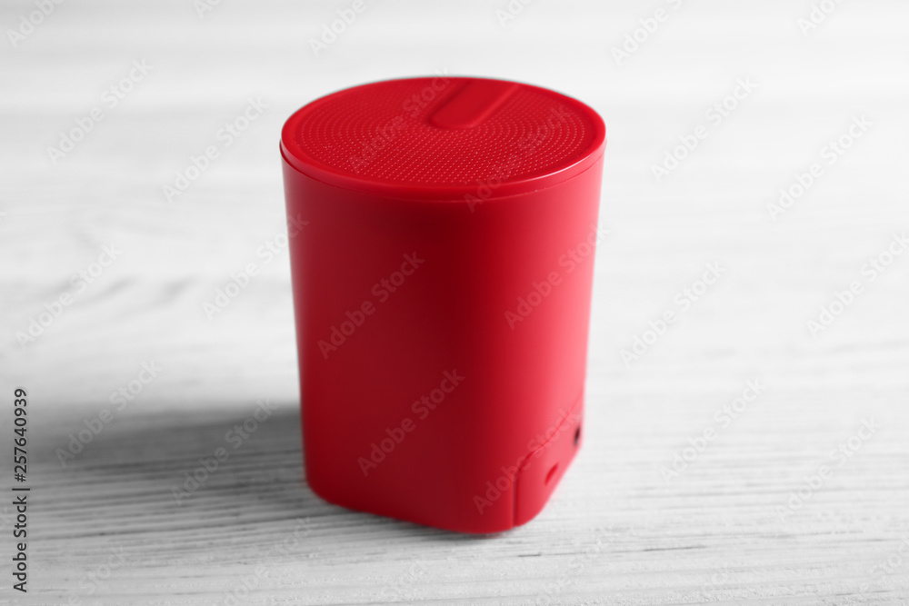 Smart home assistant device on white wooden table