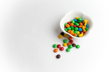 A bowl of multicolor chocolate candies