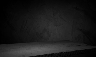 Old wood table top with smoke in the dark background.