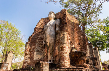 Standing Buddha statue in the temple