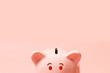 Piggy bank on living coral background. Commercial concept. Commercial concept.Top view point, flat lay.