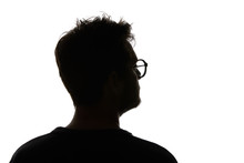 Silhouette Of Man In Glasses Looking Away Isolated On White