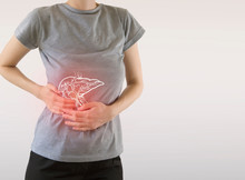 Digital composite of highlighted painful  liver of woman