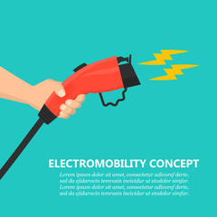 Poster - Hand holding charging plug for electric car charging station