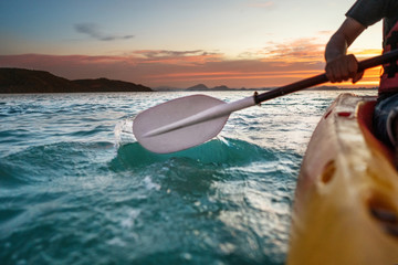 sunset kayaking at sea