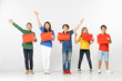 © master1305 - Group of happy surprised children with red empty banners isolated in white studio background. Education and advertising concept