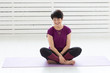 © satura_ - People, yoga, sport and healthcare concept - Relaxed smiling middle-aged woman sitting on exercise mat over white background