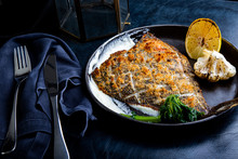 Flounder Fillet Roasted In A Skillet With Herbs And Lemon