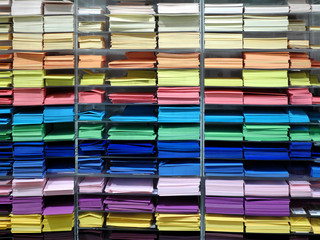 Shelf with many professional colorful sheets of paper for artists.