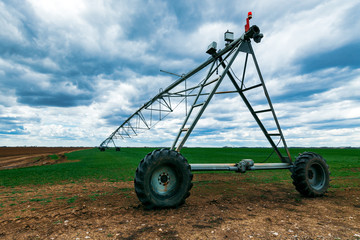 Wall Mural - Center pivot irrigation system in wheat field