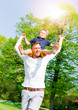© drubig-photo - happy father and son playing in park