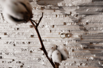 Bridal details - Wedding rings are put on flowers and twigs while bride getting ready before the ceremony