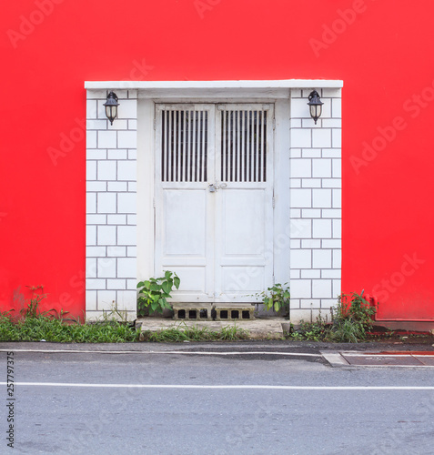 White Vintage Retro Wooden Door On Red Wall Background Home