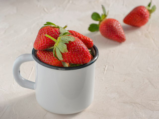 Wall Mural - Fresh red strawberries in metal cup. Strawberry in rustic cup on oriental white background