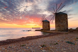 Fototapeta Natura - Sunrise image of the iconic windmills in Chios town.