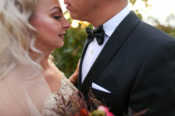 Happy wedding couple posing outdoor