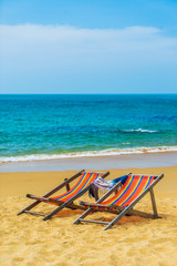 Canvas Print - Deck chairs at the beach