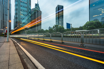 light trails in the downtown district, china.