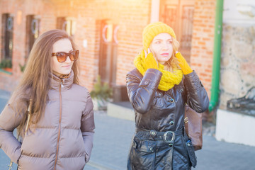 two beautiful girls walking through the streets of Minsk capital of Belarus