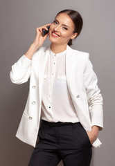 smiling business woman talking on the phone