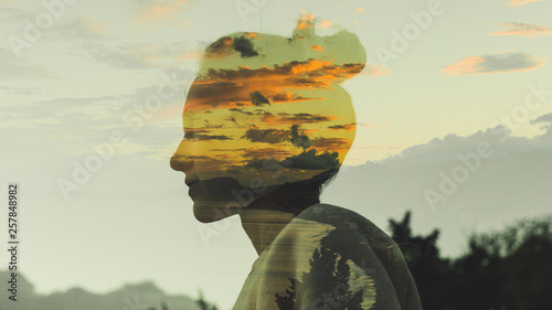 Warm Profile Double Exposure Portrait Of Young Woman With Hair Bun