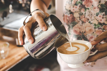 Wall Mural - Barista making latte art.