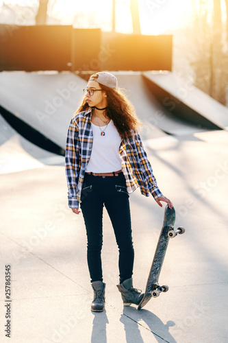 Beautiful Mixed Race Teenage Urban Girl With Curly Hair Posing With Skateboard At Skate Park Buy This Stock Photo And Explore Similar Images At Adobe Stock Adobe Stock