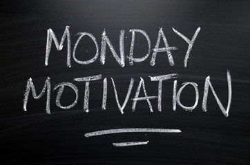The words Monday Motivation written by hand in white chalk on a blackboard as a reminder