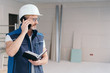 © contrastwerkstatt - Builder talking on a mobile phone