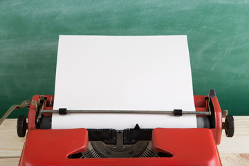 Fototapete - vintage typewriter on the table with blank paper - concept for writing, journalism, blogging