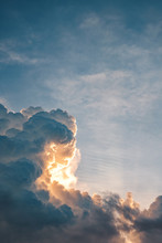 Dramatic Large Cumulus Clouds On The Sky At Sunset