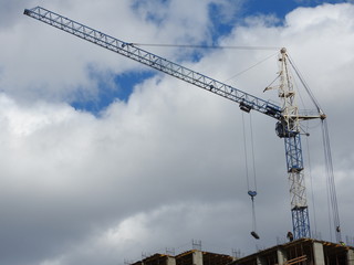 Construction site cranes, work on the construction of the house.