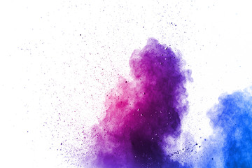 Wall Mural - purple color powder explosion cloud on white background.closeup of purple dust particles splash on b