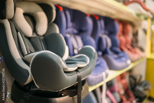 Fotomural Child car seats variety on shelf in store, nobody