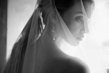 Bride Posing Close Up In A Veil