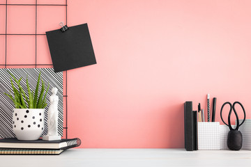 Wall Mural - Office creative desk with supplies, and pink wall.