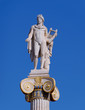 Apollo statue, the ancient greek god of music and poetry on crystal clear blue sky background