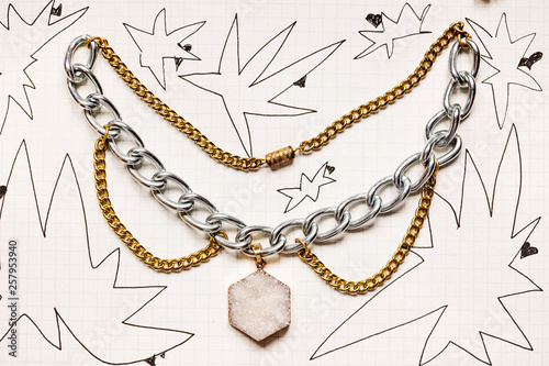 Fotomural Funky Punk style metal choker necklace on paper background