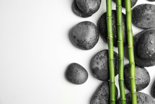 Wet Zen Stones And Bamboo On White Background, Top View With Space For Text