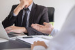 © Ngampol - Employer arriving for a job interview, businessman listen to candidate answers explaining about his profile and colloquy dream job, manager sitting in job Interview talking in office