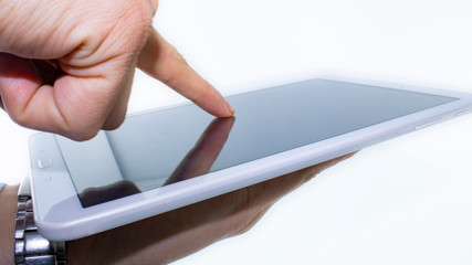 finger on the tablet